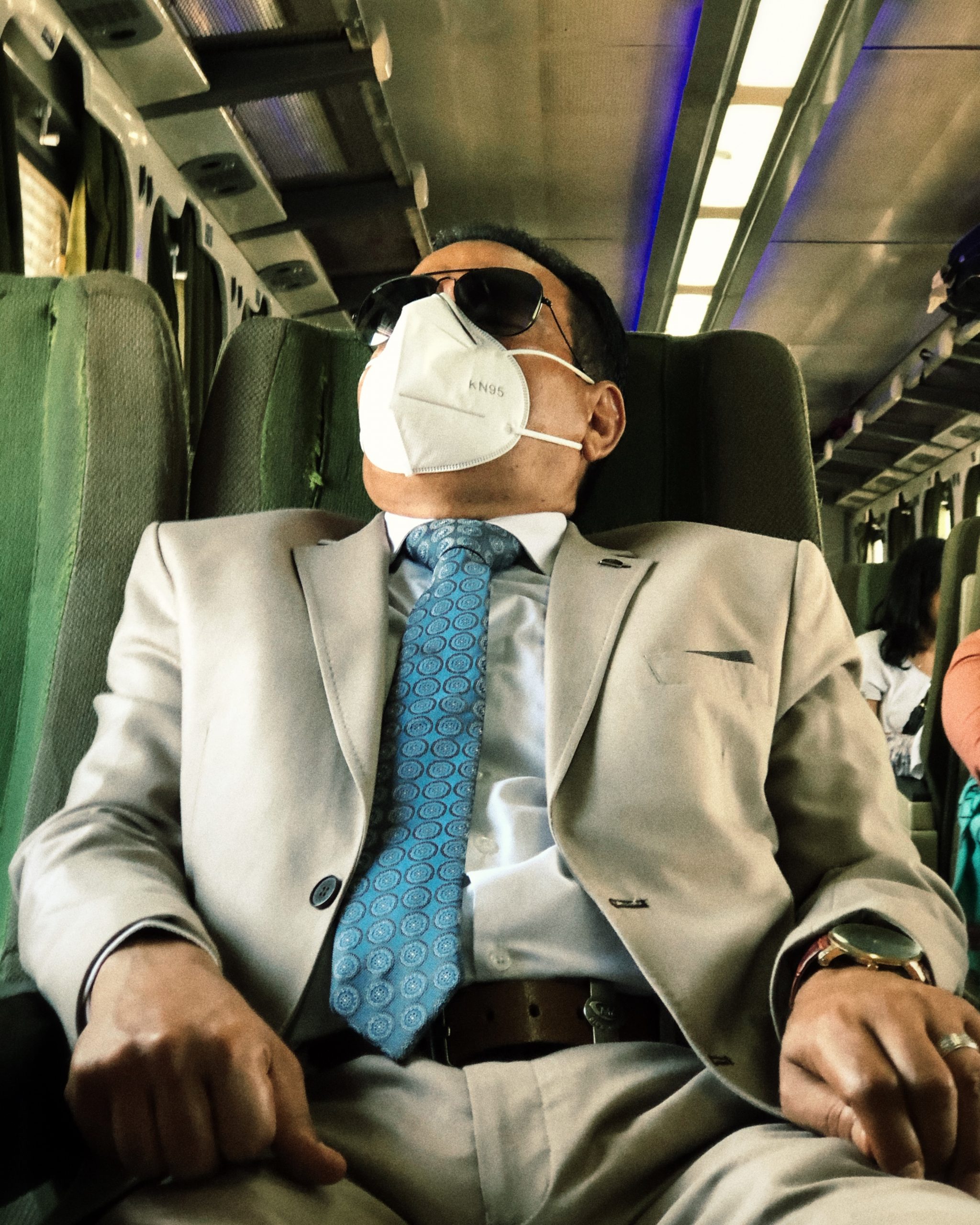 A man takes a nap before going his work in Alexandria, Alexandria train, 2020.